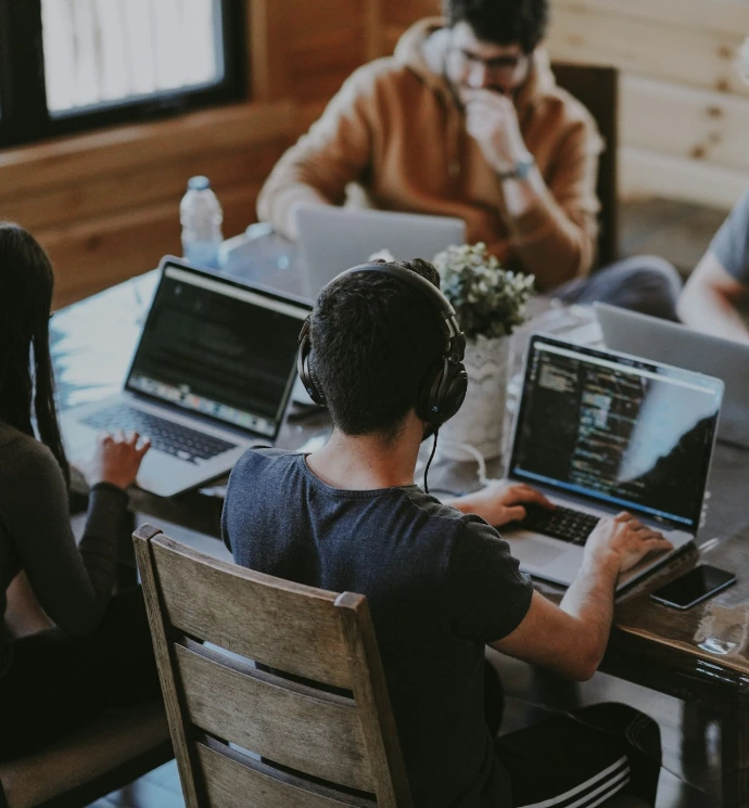 group of people using laptop computer